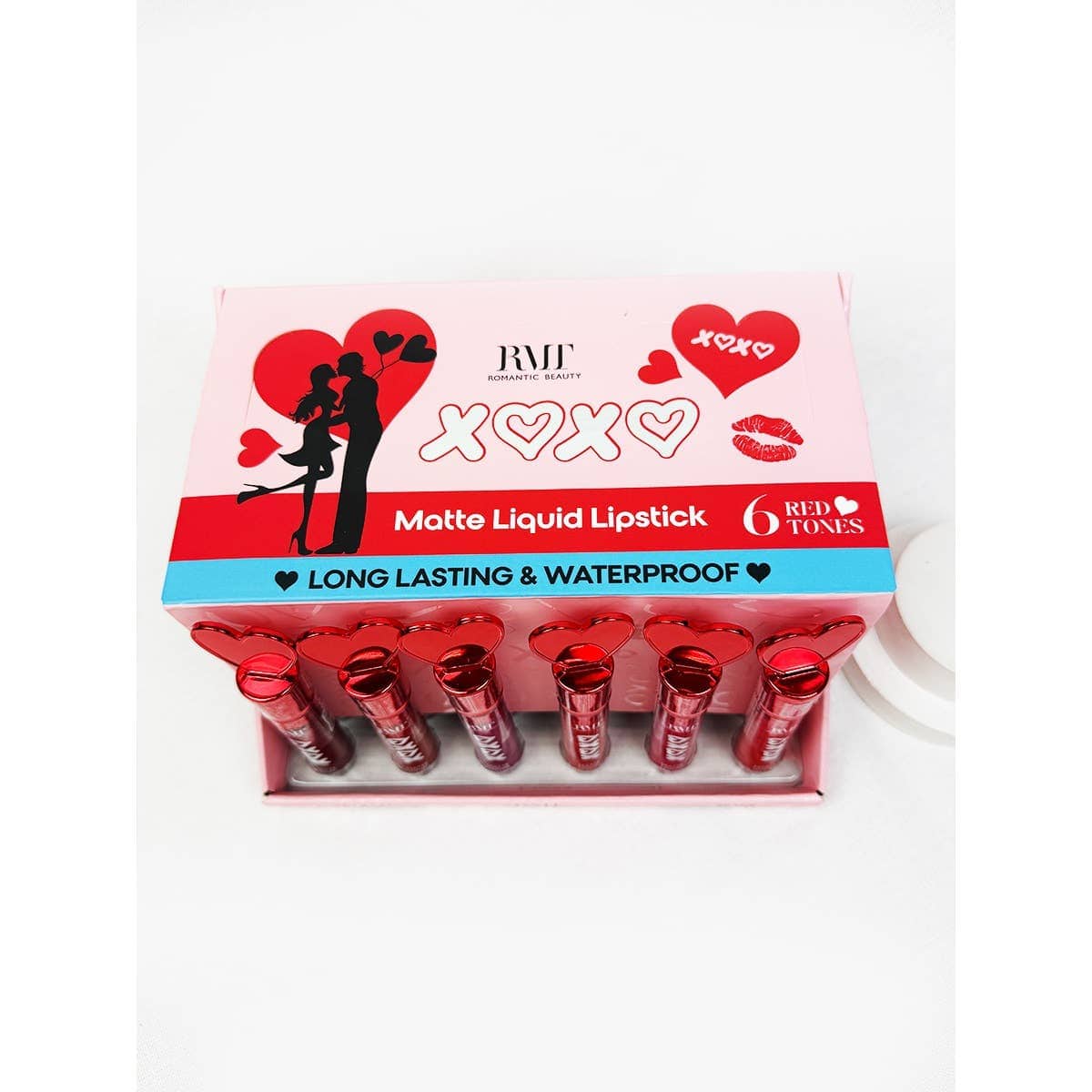 Packaging of matte liquid lipsticks in six red tones, featuring romantic silhouettes, hearts, and "XOXO." Described as long-lasting and waterproof.