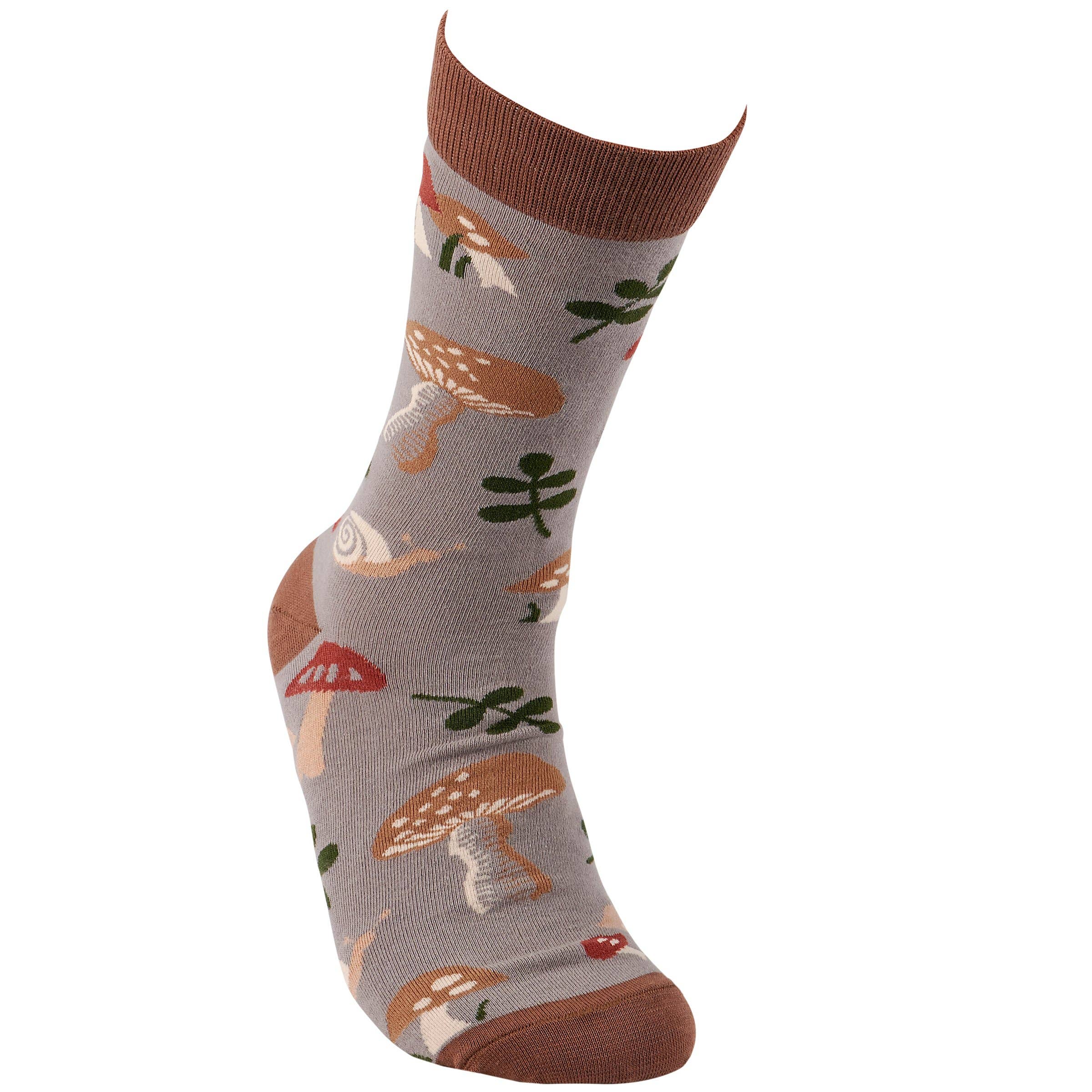 A gray sock featuring an earthy mushroom and snail pattern, with brown at the cuff, heel, and toe. The design is playful and whimsical.