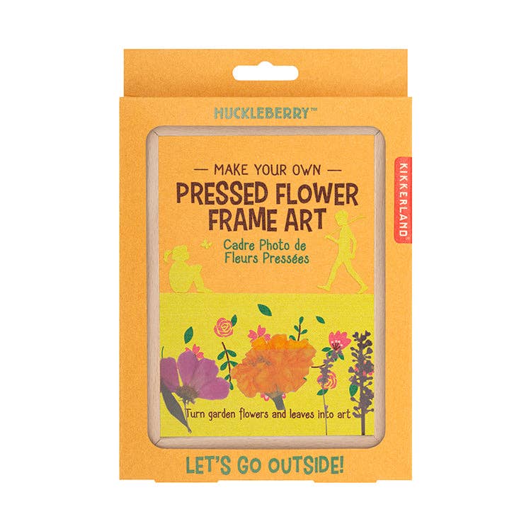 A boxed kit labeled "Huckleberry Pressed Flower Frame Art" with colorful flower illustrations and instructions to turn garden flowers and leaves into art.