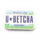 Mint tin that looks like Minnesota License Plate that states “U Betcha!”