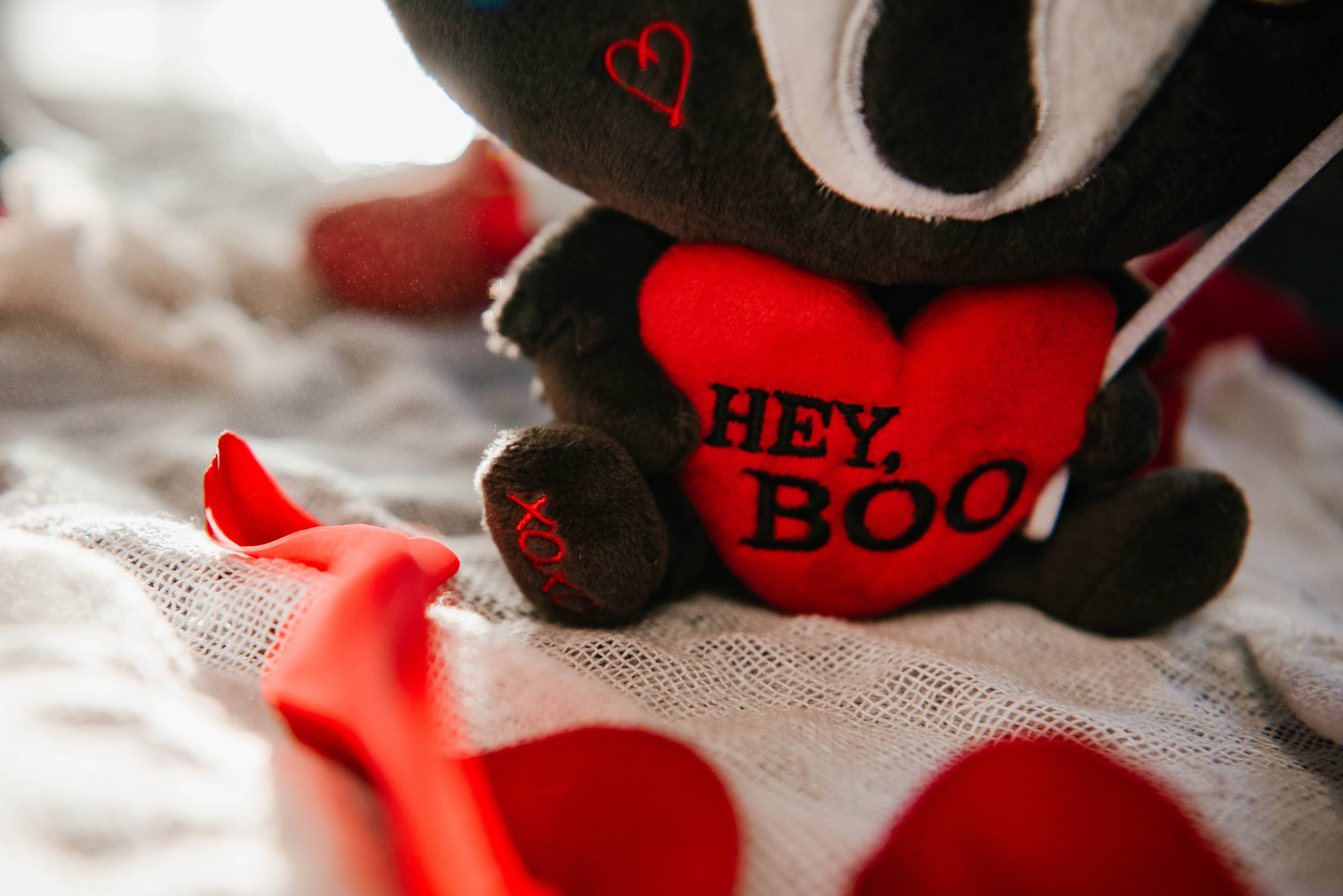 Close up of red heart with "Hey Boo" text