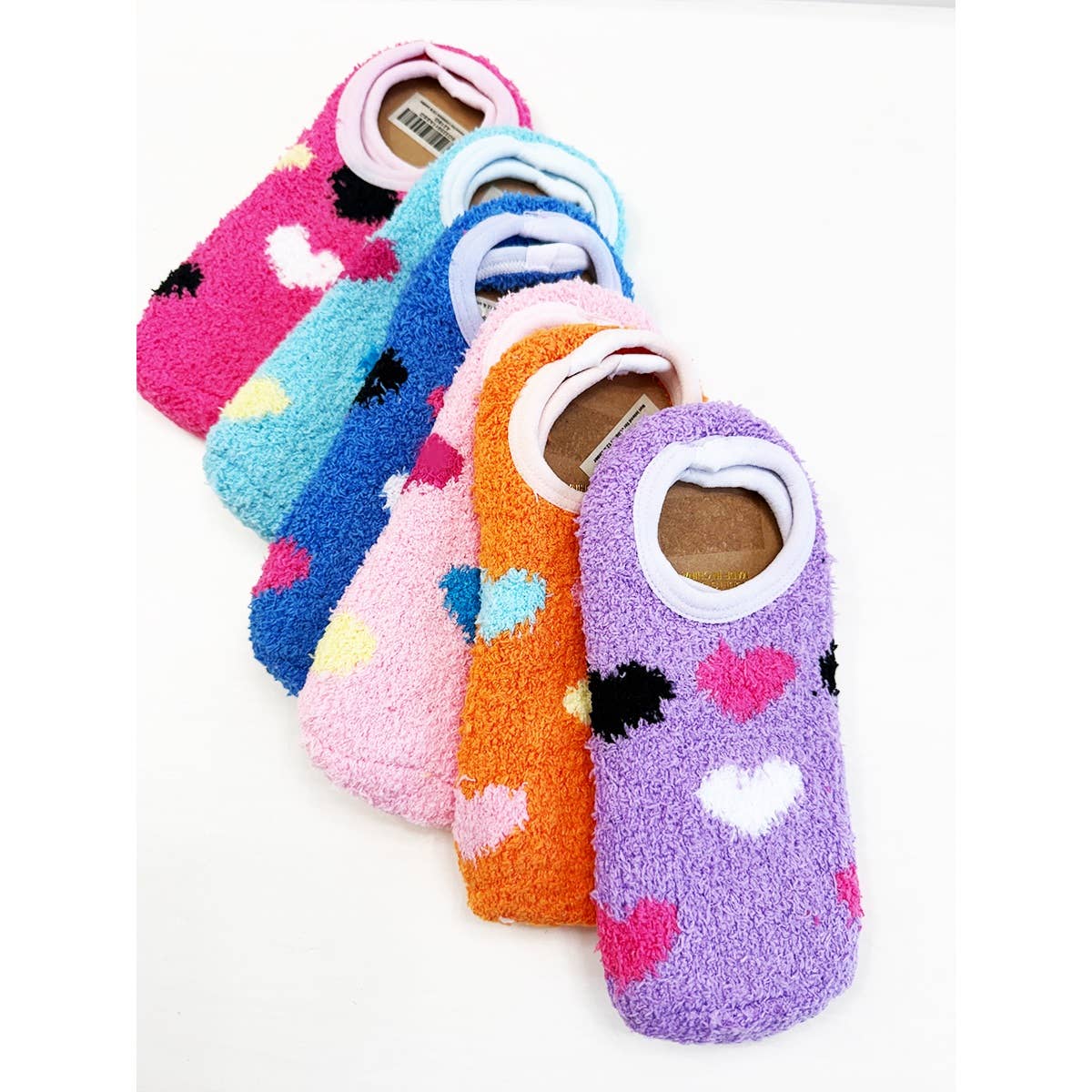 Set of colorful socks with heart patterns on a white background