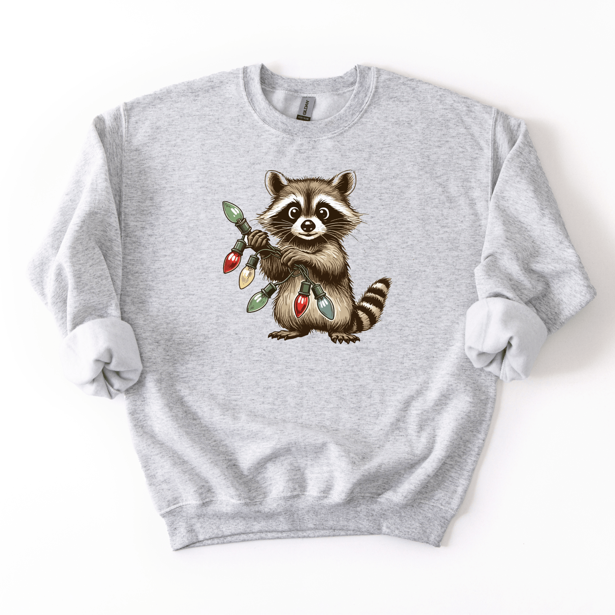 Gray sweatshirt with a raccoon holding Christmas lights design on a white background