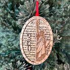 Statue of Liberty and the number 250 layered on top of another wood layer. We the people. 1776-2026