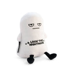 A white ghost plushie with a distressed face and black text that says "Livin' the Nightmare." It has black legs sticking out and black arms at its sides.