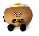 Brown baked potato plush with black legs, a white top, and a pat of yellow butter on top.