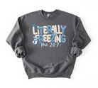 Gray sweatshirt with 'Literally Freezing Me 24/7' text and snowman graphic on a white background