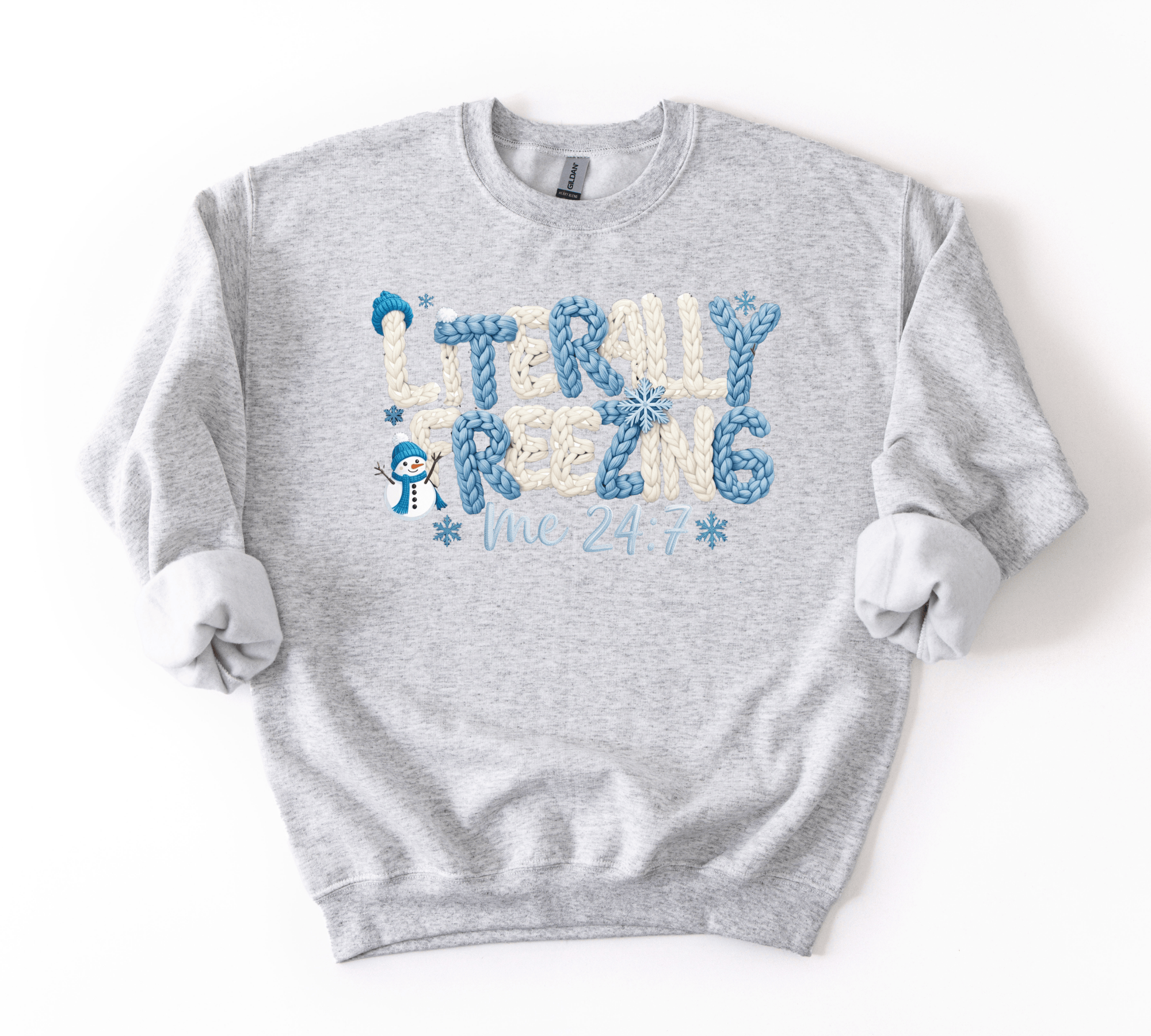 Gray sweatshirt with 'Literally Rezing Me 24/7' text and snowman graphics on a white background