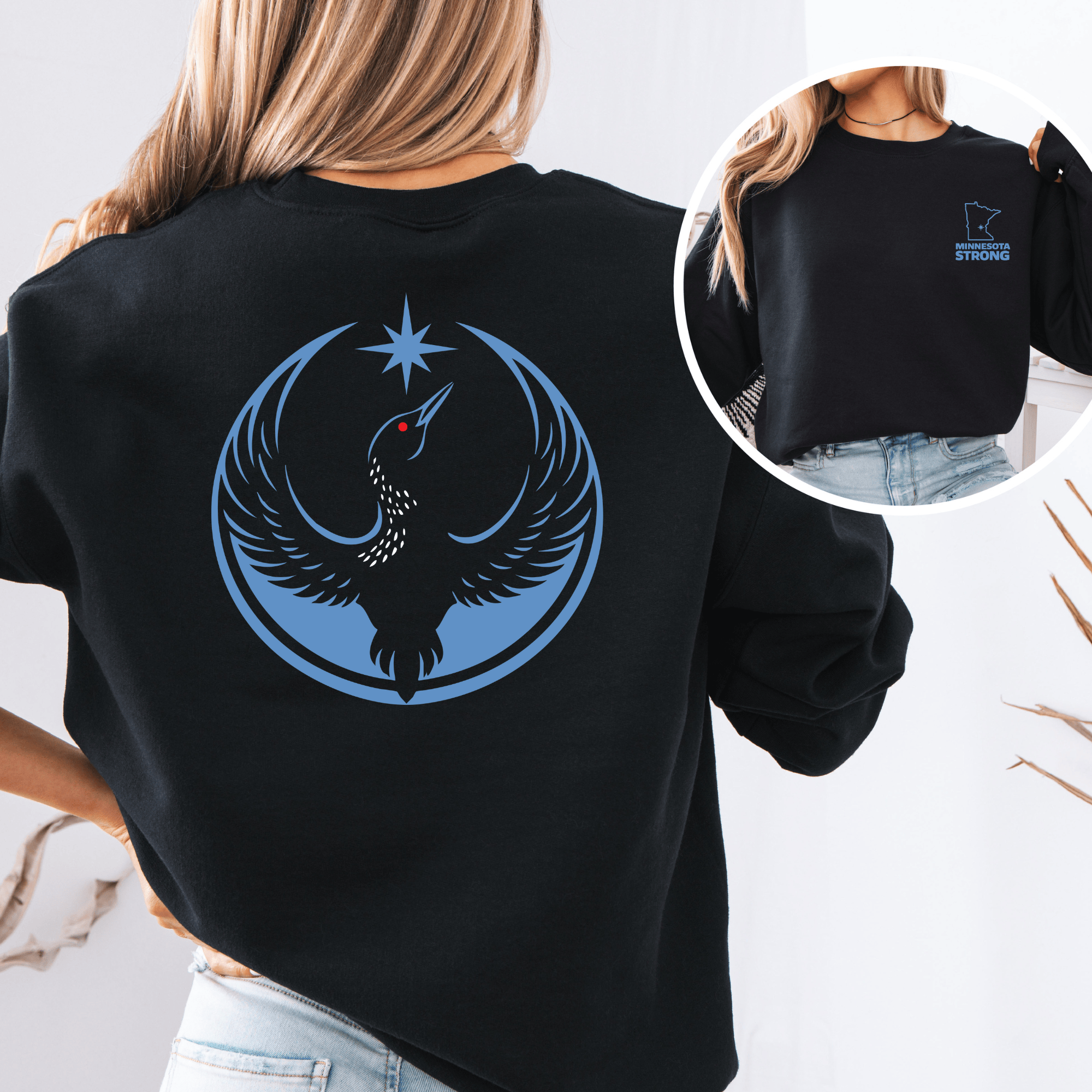 Black Crew Neck Sweatshirt with the Rebel Loon Design on the back and a front pocket logo design of the Minnesota State Outline and the words "Minnesota Strong"