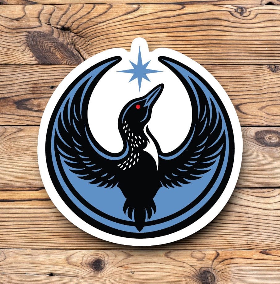 Image of Rebel Loon Sticker.  Rebel Loon image shows a Loon Bird with wins raised up toward the north star.  The bird is blue and black with a red eye and the north star is the same color blue.  Sticker is a circular shape.