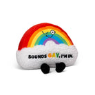 Rainbow plush with a winking face and white clouds underneath. The phrase 'Sounds Gay, I'm In' is embroidered, with 'Gay' in orange, yellow, and green font, and the other words in black. Black legs stick out from the bottom of the plush.