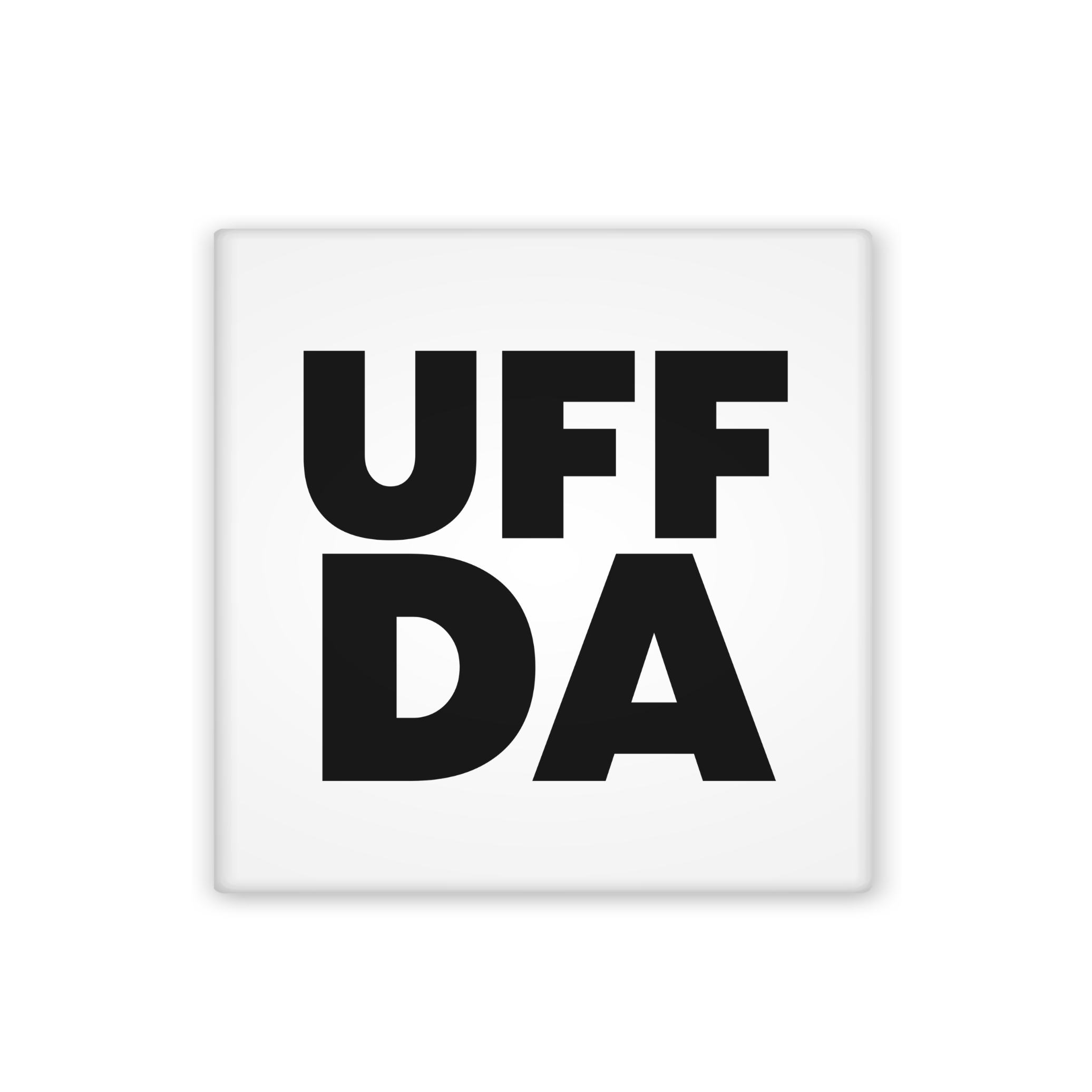 A square white coaster or tile featuring the text 'UFF DA' in bold black capital letters, centered on a plain white background.