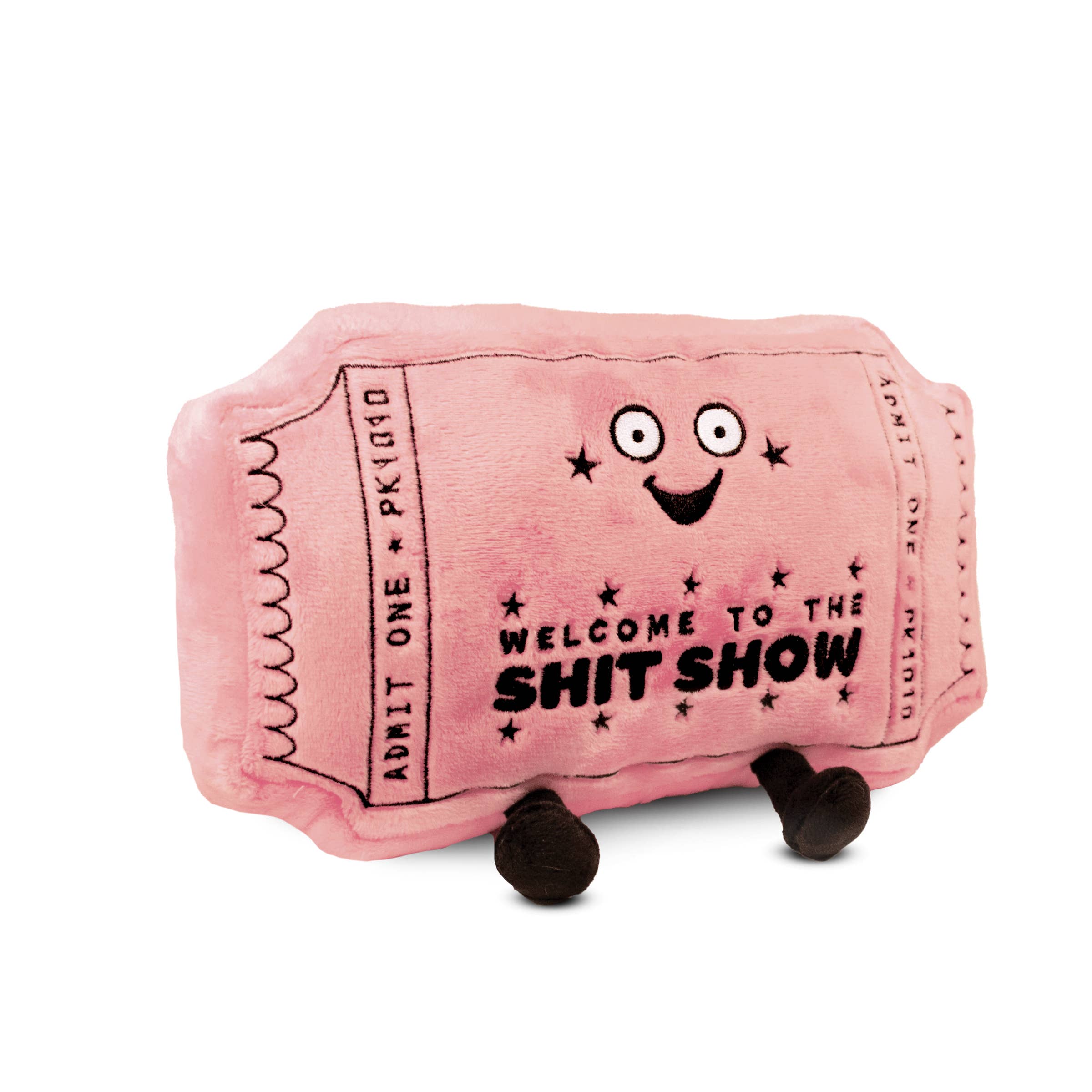 A pink plushie shaped like a movie ticket with a smiley face. It features black embroidery with the words "welcome to the shit show.