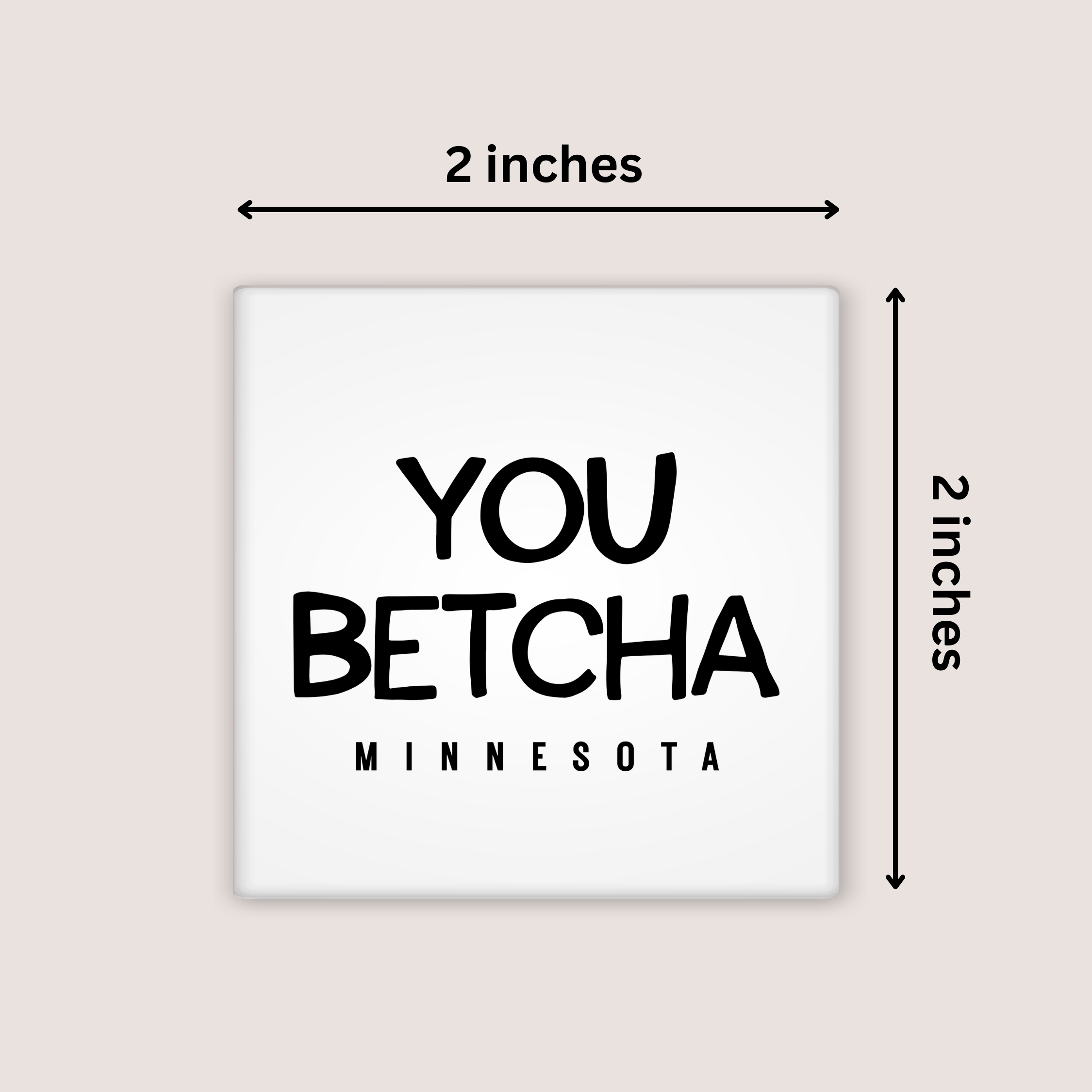 A square white magnet with the phrase “YOU BETCHA MINNESOTA” in black text, shown on a light beige background with dimension arrows labeling it 2 inches by 2 inches.