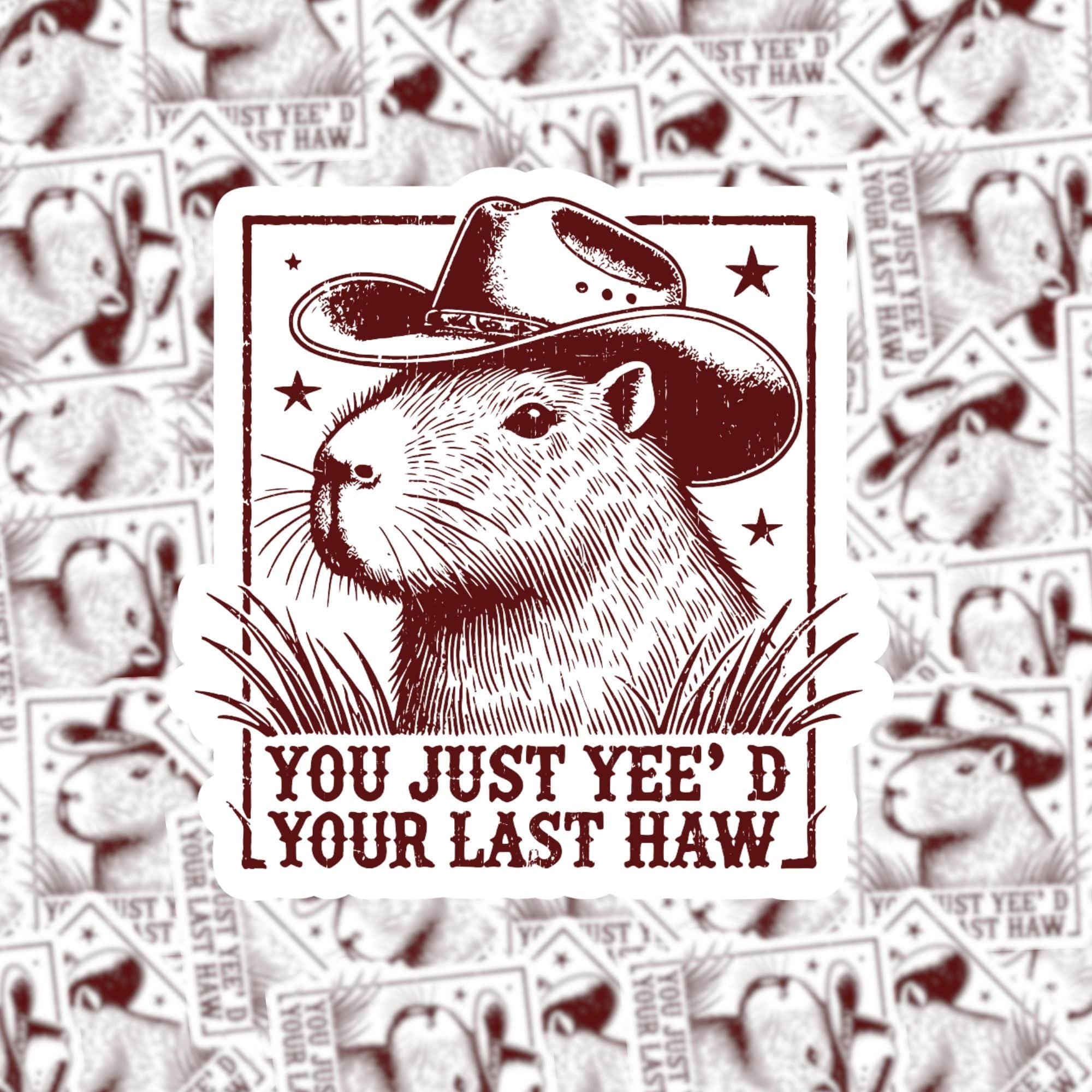 A sticker of a cartoon capybara wearing a cowboy hat with the text 'You just yee'd your last haw'.