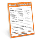 Humorous "Passive-Aggressive Note" pad with checkboxes for suggestions like improving hygiene or getting a life. Tone is sarcastic and playful.