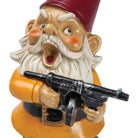 A ceramic garden gnome with a long white beard and red hat holds a toy gun, looking surprised. It wears a yellow coat and a black belt. The scene is humorous.