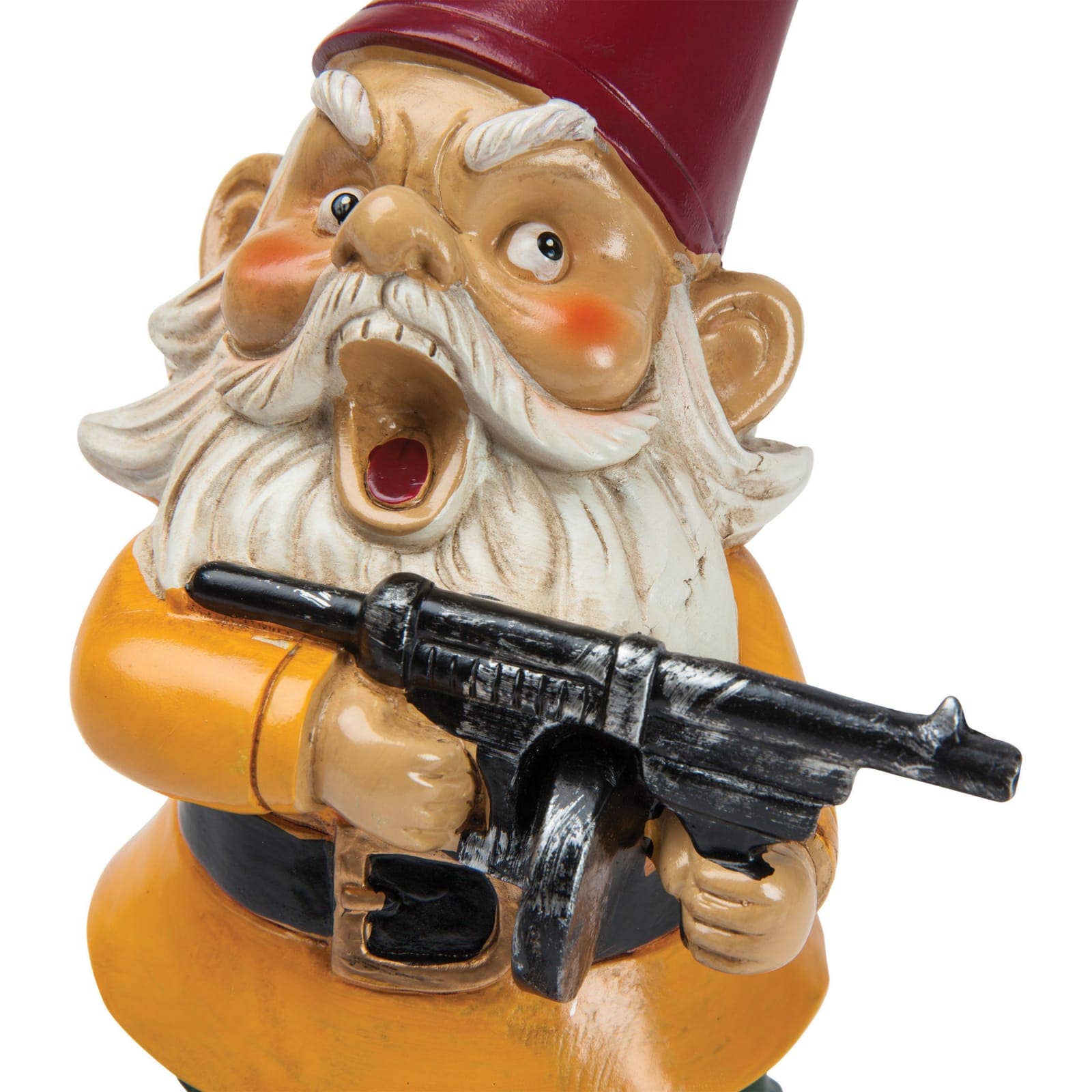 A ceramic garden gnome with a long white beard and red hat holds a toy gun, looking surprised. It wears a yellow coat and a black belt. The scene is humorous.