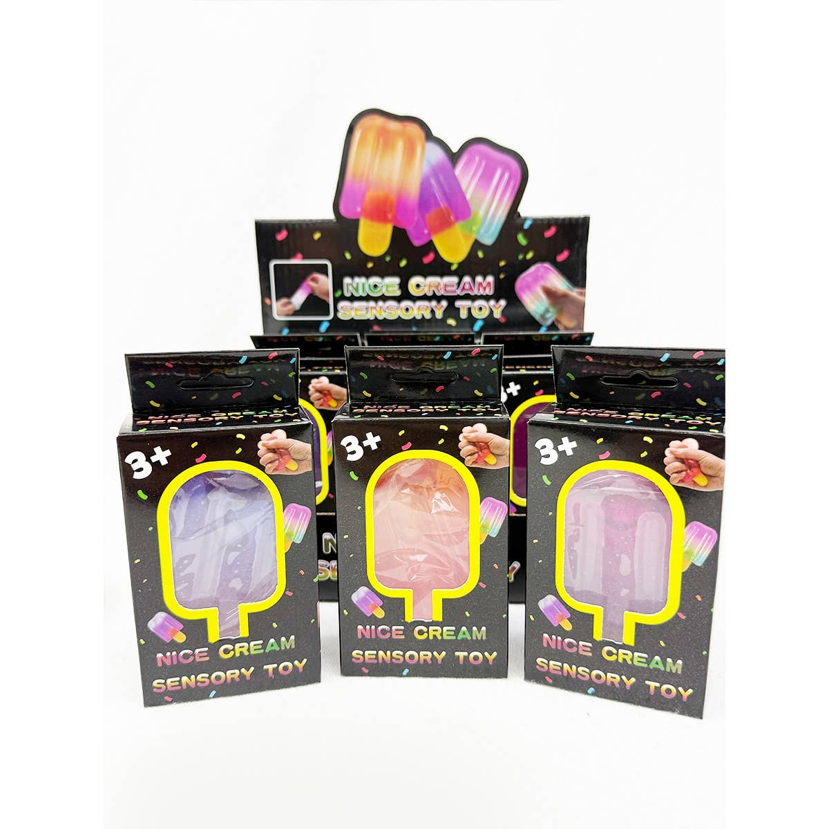 Three individual retail boxes for "Nice Cream Sensory Toy" featuring colorful popsicle designs and cutout windows displaying translucent pink and purple squishies, arranged in front of a larger countertop display box.