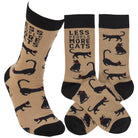 Tan socks with black cats that say "Less People More Cats" in black text.