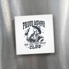 Fridge magnet with a design of a person in a cowboy hat and boots, holding a bottle, with text 'Proud Member of the We Do Not Care Club' on a metallic surface.