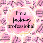 Sticker says, "I'm a fucking professional." with a pink and gold splattered, splash background and gold hexigonal rings around.
